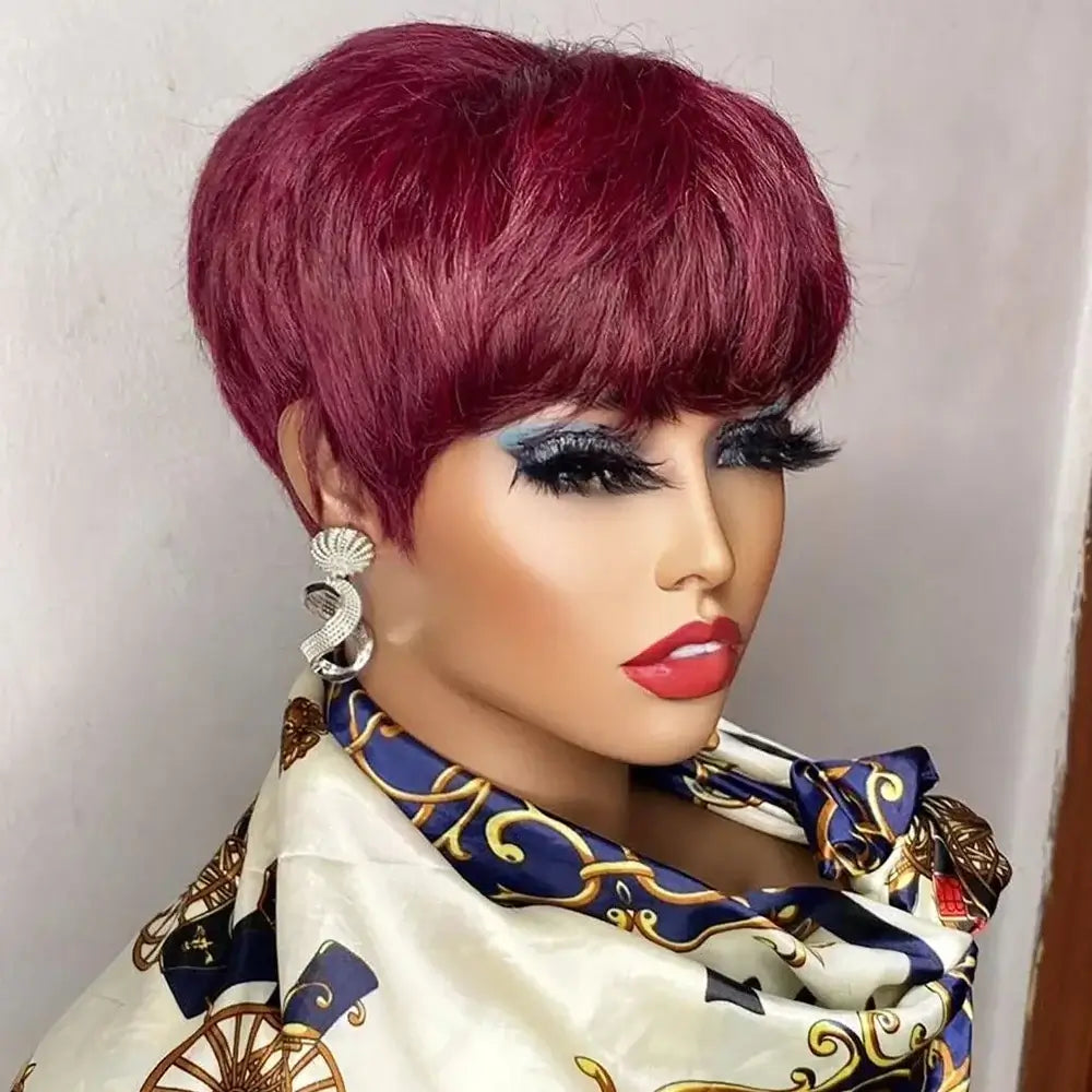 Short burgundy wig styled elegantly, featuring a chic cut and framed face, accessorized with bold makeup and jewelry.